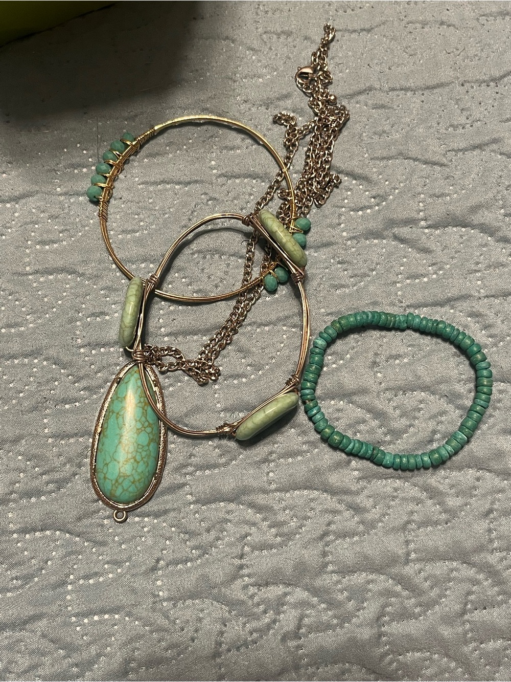 Turquoise bracelets and  a neckless 3 bracelets and one neckless